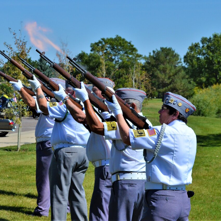 A team of Veterans from the All Veterans Honor Guard conduct the rifle detail during a funeral service.